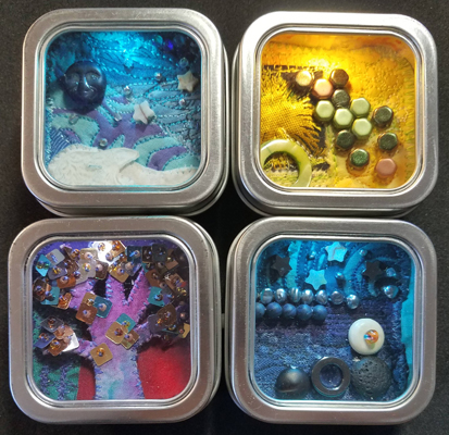 four small tins